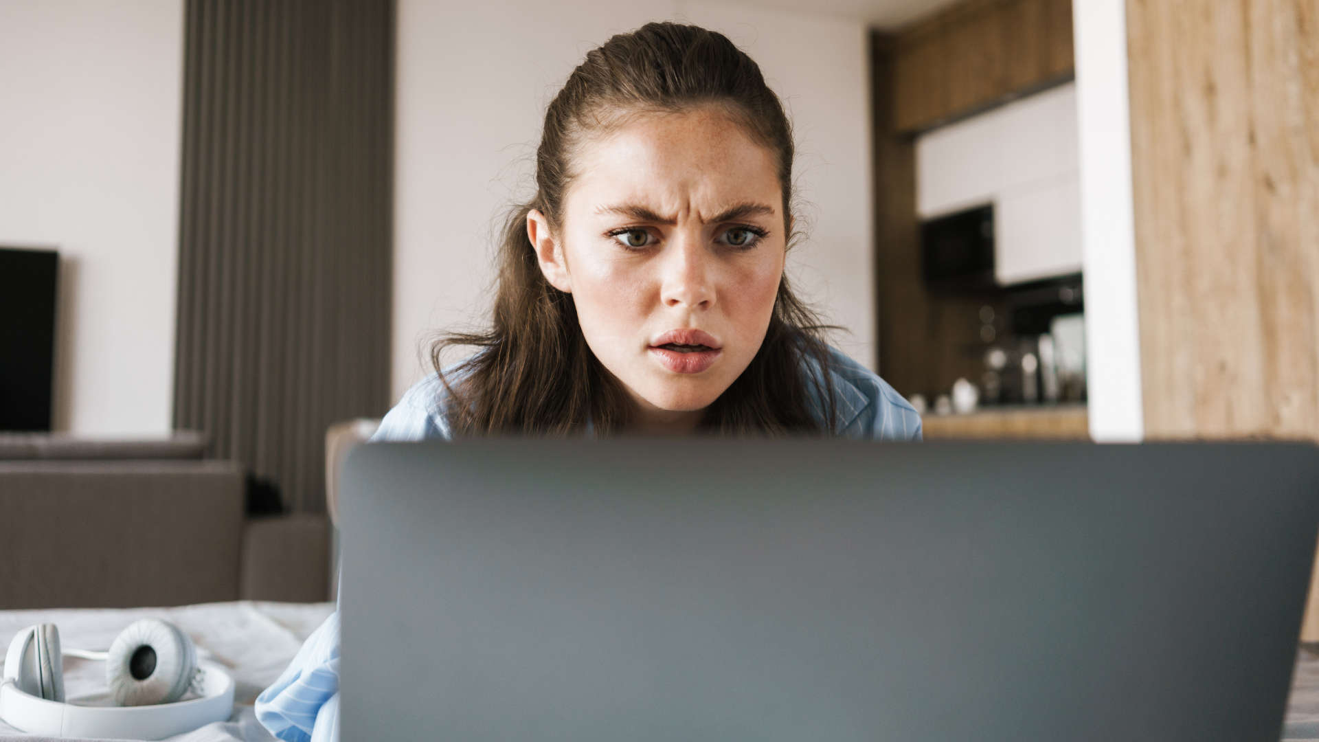 woman frowning at computer screen